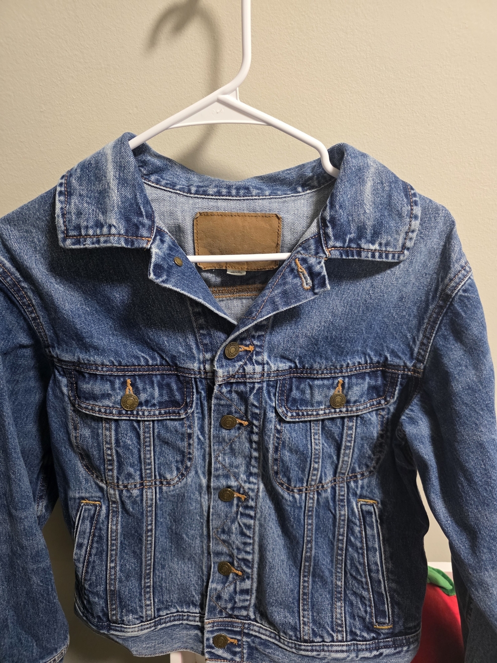 American Eagle Outfitters indigo denim jacket with tan leather label